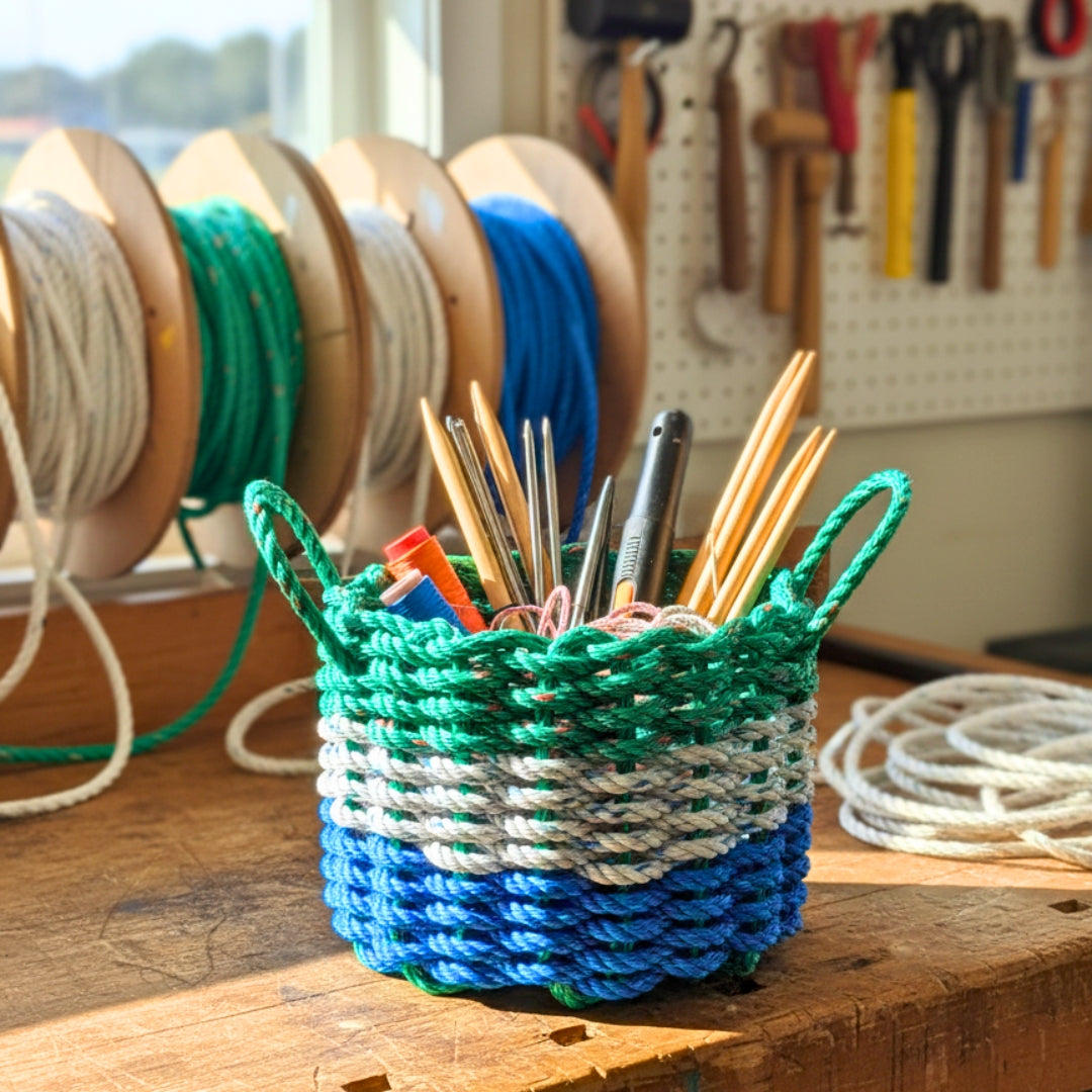 Blue Gray and Green Rope Basket in workshop filled with tools