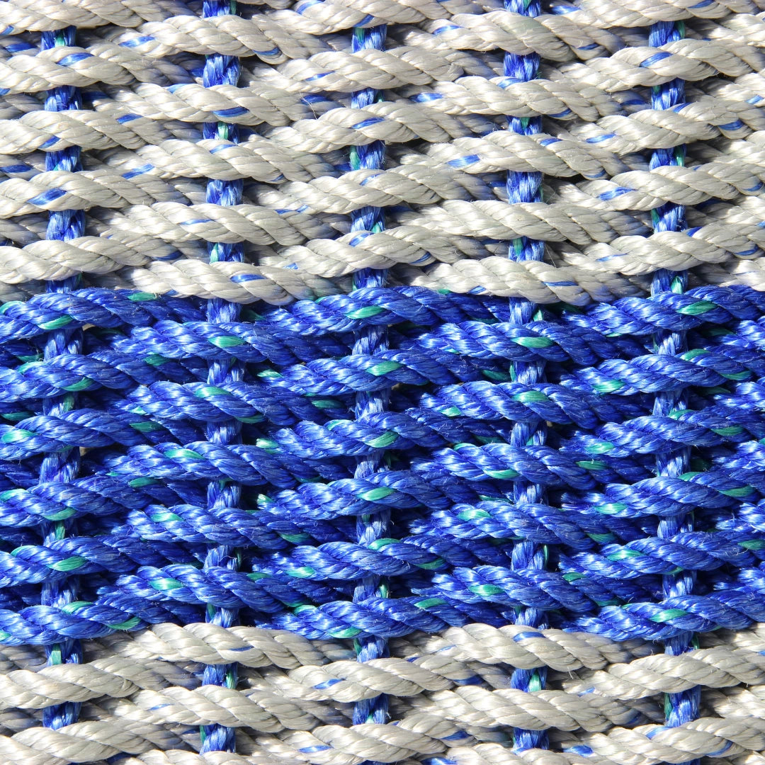 Close-up of blue, gray, and green braided rope pattern
