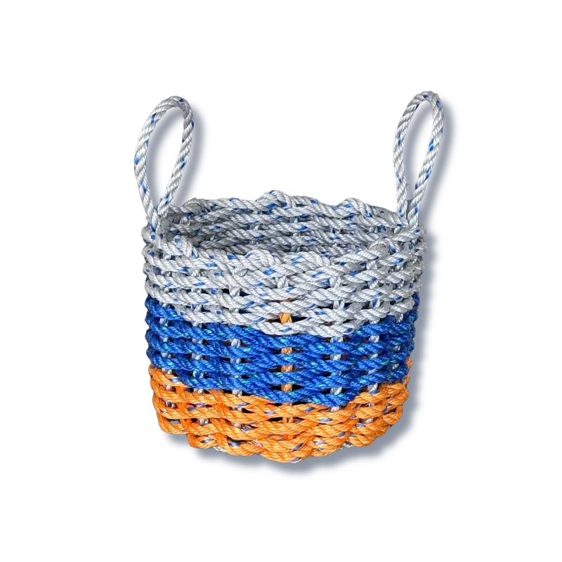 Woven basket with blue, orange, and gray pattern on a white background
