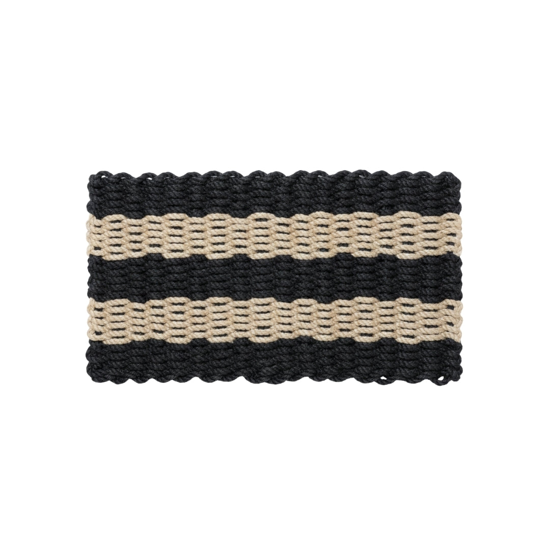 Rectangular doormat with black and beige stripes on a white background