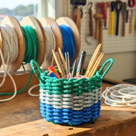 Blue Gray and Green Rope Basket in workshop filled with tools