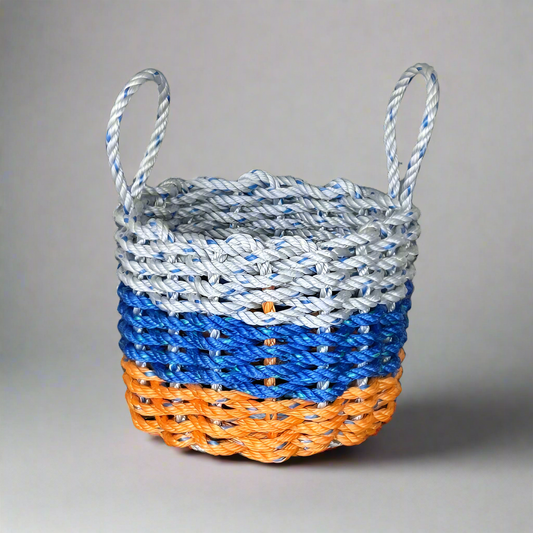 A handwoven lobster rope basket with blue, grey, and orange colors, featuring two handles.