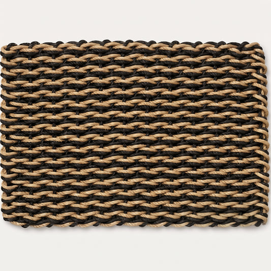 Black and tan double weave lobster rope doormat against a light gray background. This luxurious, outdoor resilient doormat will not fade, rot or mildew for years.