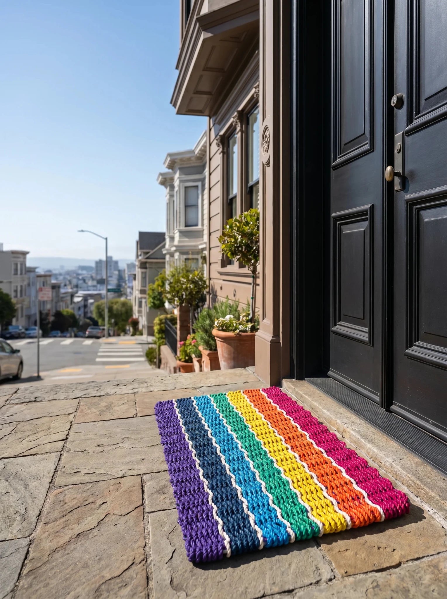 Large Outdoor Doormat 24x48 Handwoven Rope Construction Rainbow Striped Pattern Signature Tighter Weave System Prevents Curling Dense Flat Design Red Orange Yellow Turquoise Blue Navy Purple White Borders Limited Edition Entrance Mat