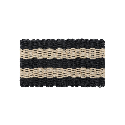 Rectangular doormat with black and beige stripes on a white background